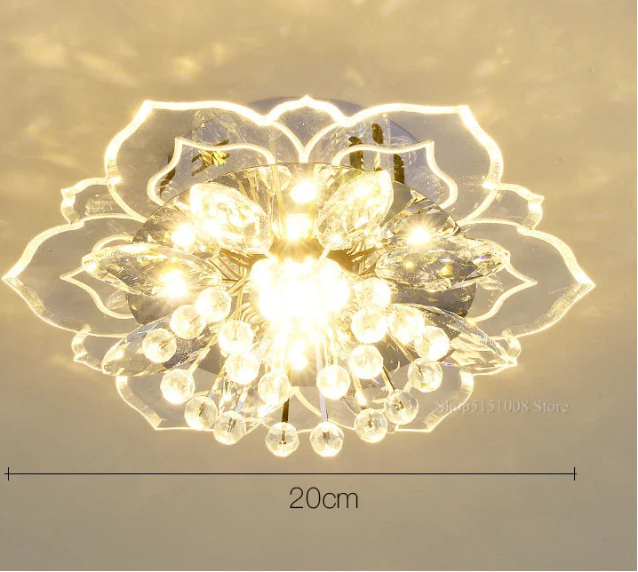 Lustre boule en cristal avec fleurs, éclairage coloré pour intérieur.