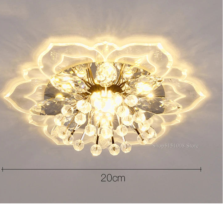Lustre boule en cristal avec fleurs, éclairage coloré pour intérieur.