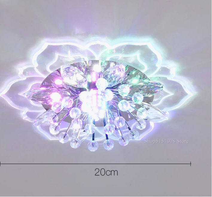 Lustre boule en cristal avec fleurs, éclairage coloré pour intérieur.