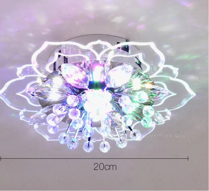 Lustre boule en cristal avec fleurs, éclairage coloré pour intérieur.